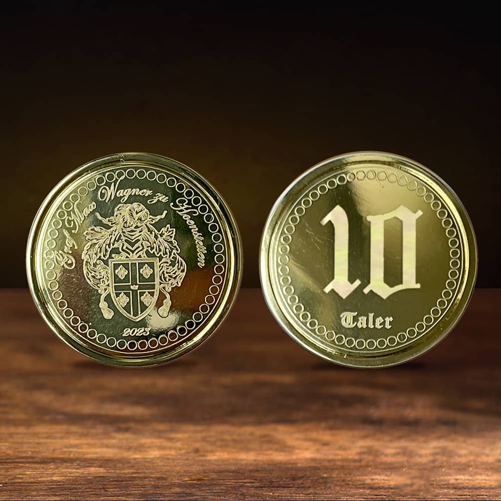 Monedas personalizadas de oro o plata con nombre y escudo de armas, diseñadas como una moneda privada única.